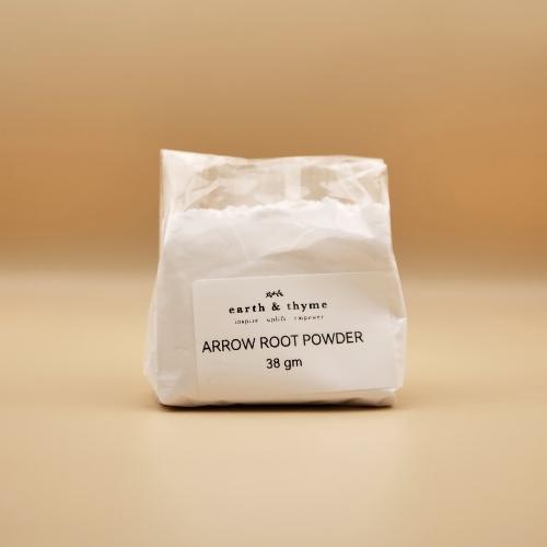 Bag of arrow root powder with 'earth & thyme' label on a beige background