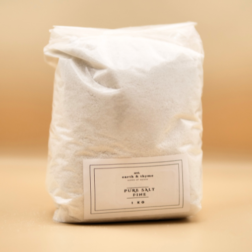 Bag of pure salt with a label on a beige background