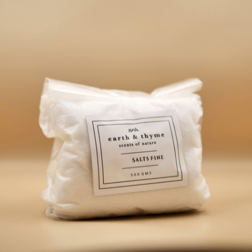 Packaged product labeled 'earth & thyme' on a beige background