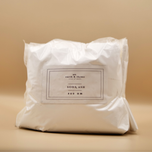 Bag of soda ash with a label on a beige background