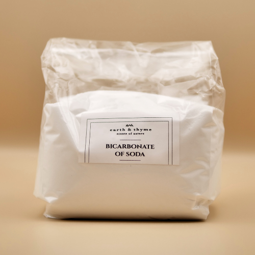 Bag of bicarbonate of soda with a label on a beige background