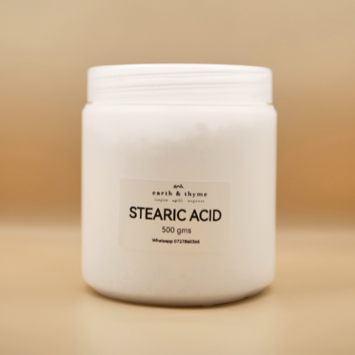 Jar of stearic acid on a beige background