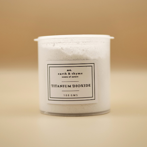 Container of titanium dioxide with a label on a beige background