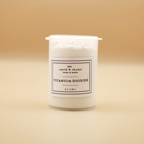 Jar of titanium dioxide powder with a label on a beige background